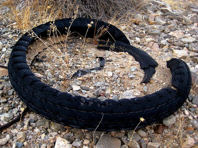 The inner tube style truck tire came from a turn of the century auto, possibly a Model T.