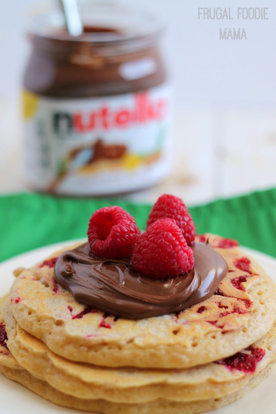 Raspberry Swirl Pancakes with Nutella- These soft and hearty raspberry swirled pancakes are perfect topped with a little Nutella #spreadthehappy
