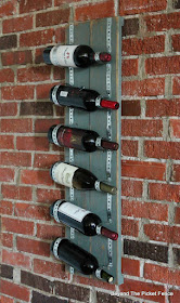 Use pallet boards and plumbers tape to make an industrial wine rack