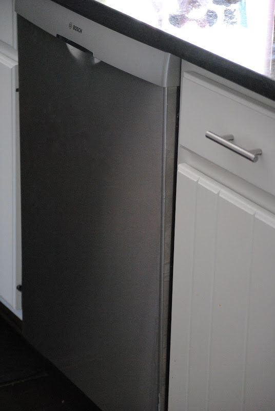 painted white kitchen cabinets and Bosch dishwasher {budget kitchen renovation}