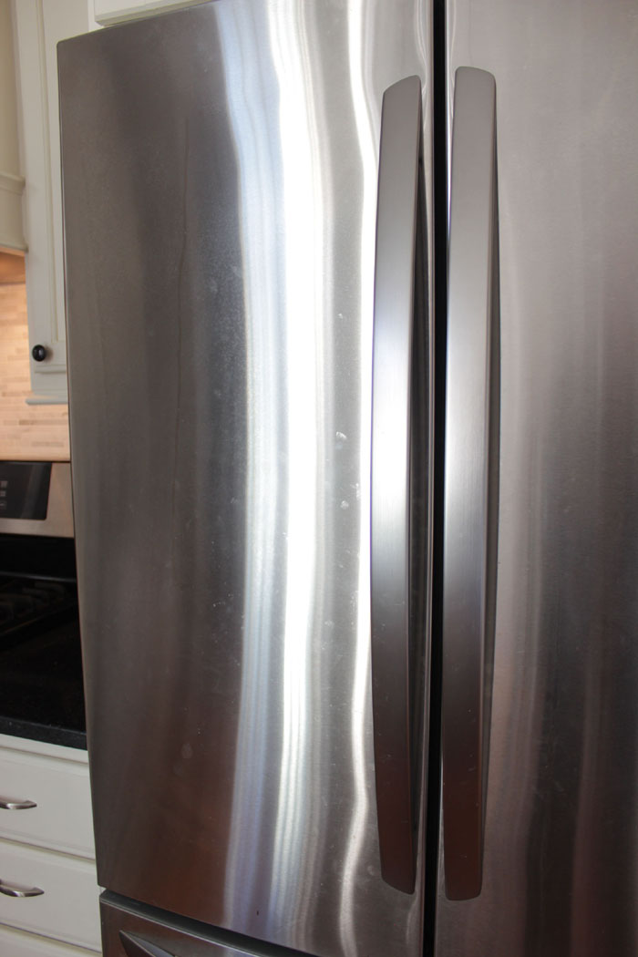 stainless steel fridge before being cleaned.