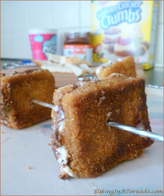 S'more Dessert Sandwiches, all the flavors of a s'more in pan fried mini dessert sandwiches. You don't need to be cooking out to enjoy these treats. | Recipe developed by www.BakingInATornado.com | #recipe #dessert |