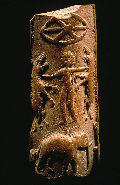 Harappa molded tablet H95-2486, showing a person standing on an elephant and grappling with two tigers