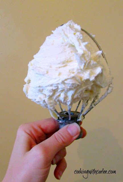 Adding a little "liquid gold" sweetened condensed milk to buttercream makes it feel extra special. It add that little bit of rich depth of flavor you can't get anywhere else! beater full of sweetened condensed milk buttercream frosting