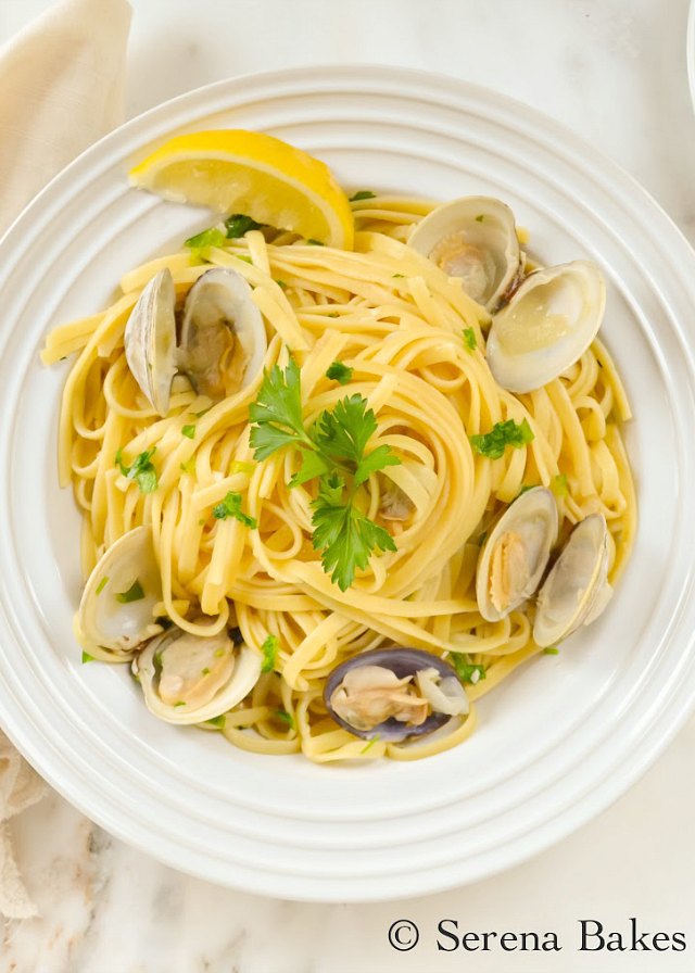 Clams with Linguine in a White Wine Butter Sauce recipe is a favorite for dinner. It's elegant yet easy to make from Serena Bakes Simply From Scratch.