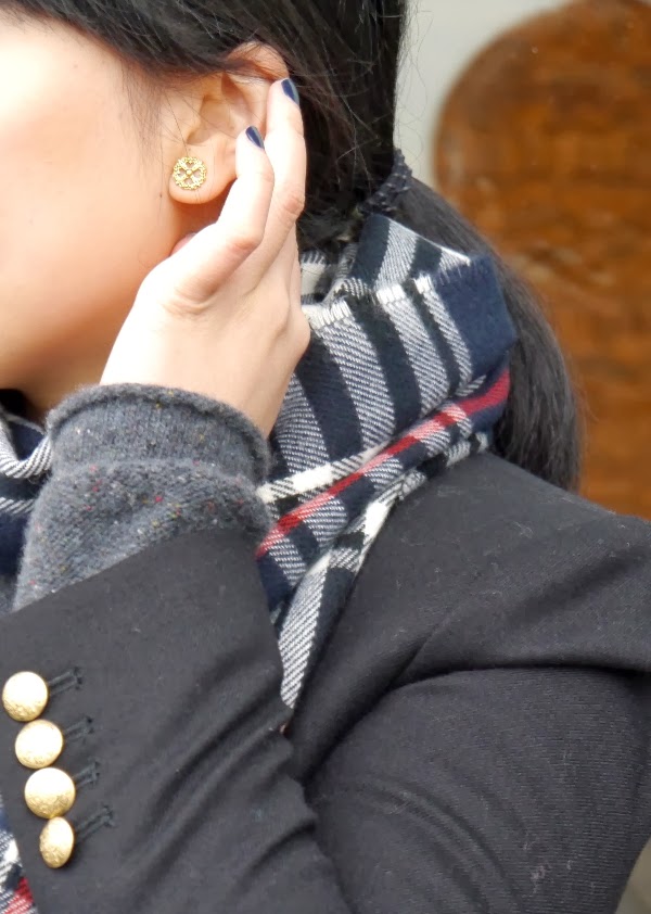 Details: fancy gold stud earrings, navy nails, gold buttons, plaid scarf
