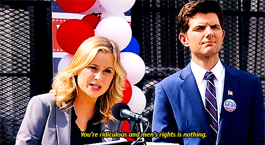 screenshot of Leslie and Ben at a political rally in Parks and Recreation; closed captioning shows Leslie is saying, 'You're ridiculous and men's rights is nothing.'