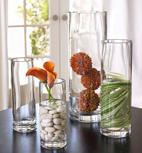 These natural table arrangements use flowers, rocks, and leaves