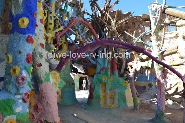 A mishmash of branches and trees create this colorful structure