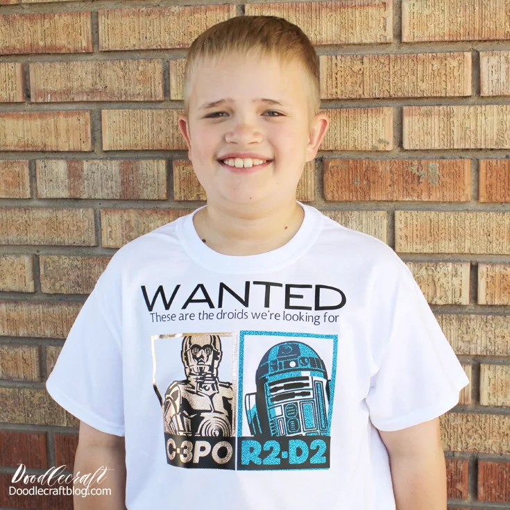 Smiling 9 year old boy wearing star wars shirt with r2d2 and c3po in iron on vinyl
