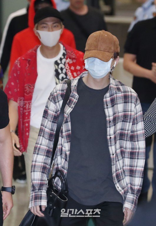 BTS covers up at the airport