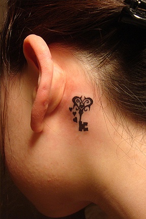 Key and heart tattoo behind the ear 