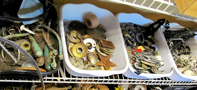 tubs of aged metal and rusty hardware ready to used in artwork