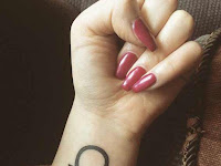 Libra Sign Tattoo On Finger
