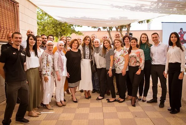 Queen Rania wore Chloe hoop trim contrast panel blouse, Proenza Schouler crepe midi skirt and Dior D-Choc pumps