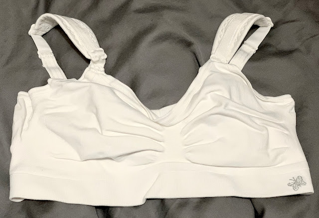 A white soft nursing bra without structure is an essential for breastfeeding a newborn