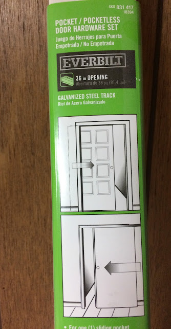 DIY your own barn style door using a slab and pocket door hardware.