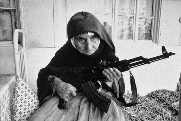 These 15 Incredibly Rare Historical Photos Will Leave You Speechless - 106-year-old Armenian woman guards her home in 1990.