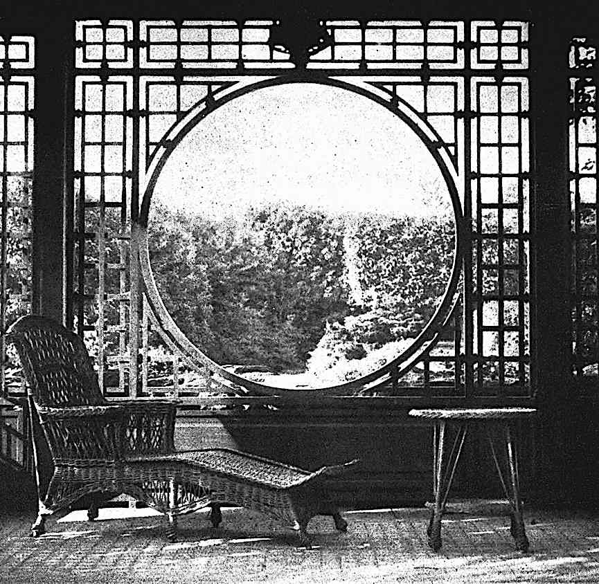 1922 sun room a photograph of a 1922 sun room circular window with wicker chaise longe