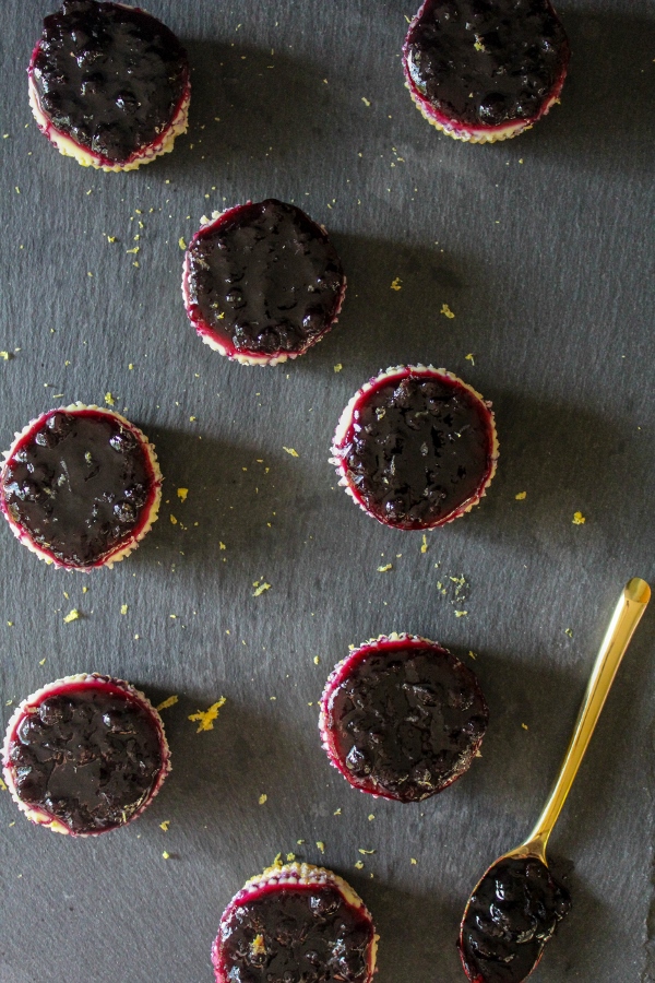 These luscious mini cheesecakes are bright and fresh and have a buttery shortbread crust. Topped with flavorful bluberry preserves, they are the perfect bite sized summer dessert!
