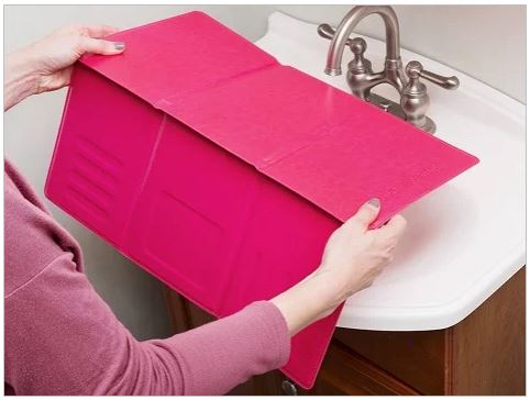 pink foldable makeup mat for over the sink