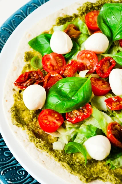 Lunchtime Caprese Pizza Wraps. Delicious and quick wraps with the flavours of a caprese salad. Suitable for vegetarians. 