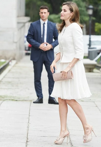 Queen Letizia wore BOSS HUGO BOSS Jeisana Textured Peplum Jacket. Felipe Varela clutch bag and Magrit sandals