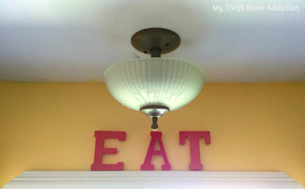 How to give dated light fixtures an instant farmhouse update with repurposed finds! DIY updated farmhouse light fixture