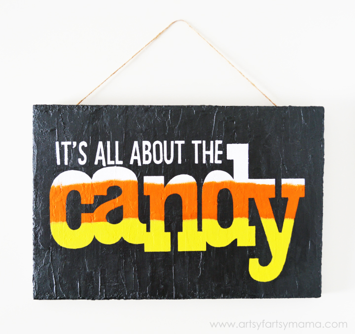 Halloween "It's All About the Candy" Sign at artsyfartsymama.com #MakeItFunCrafts