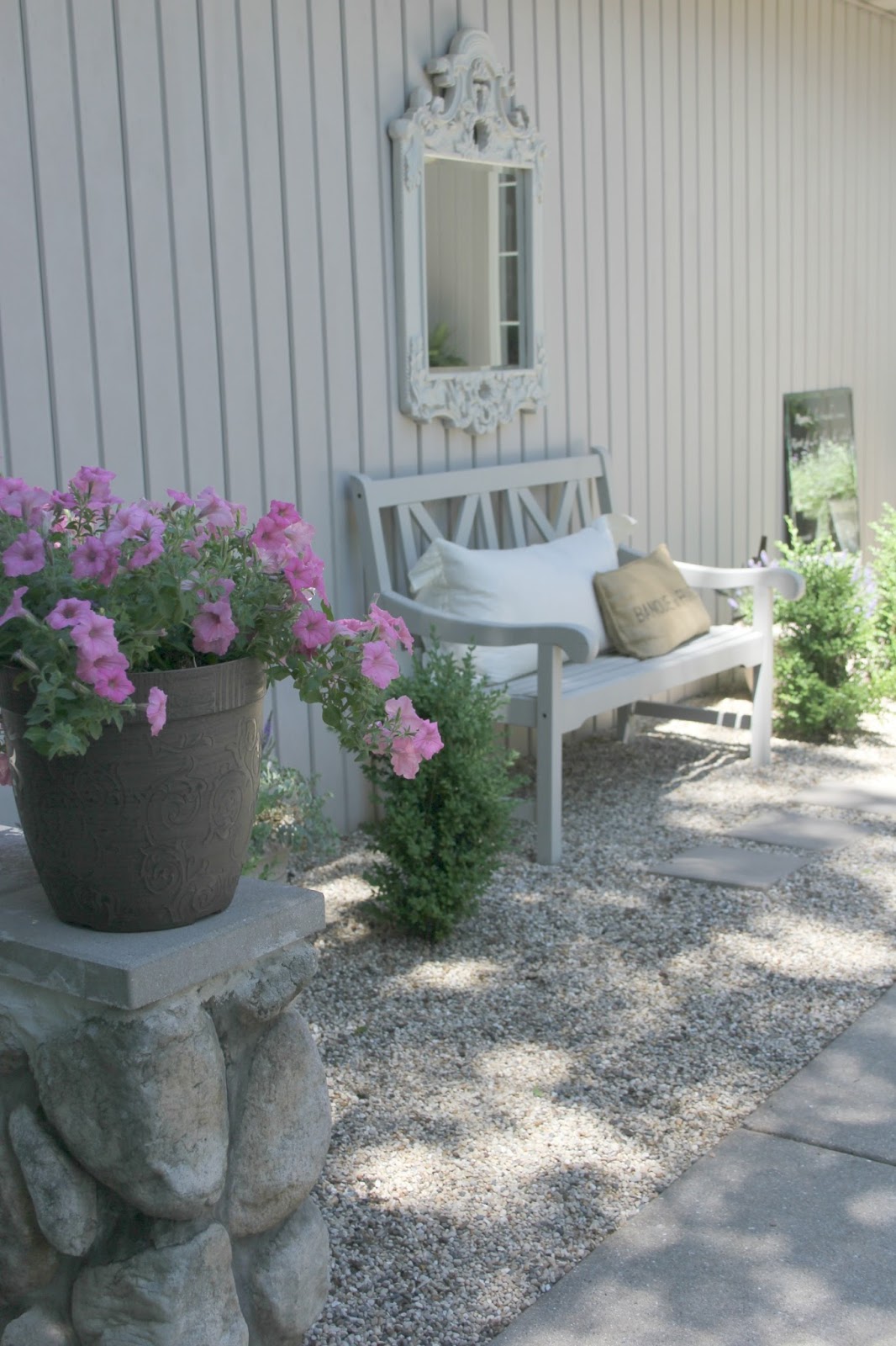 Peaceful living in a French country courtyard with pea gravel. Come be inspired on Hello Lovely by 7 Low Cost Timeless Decorating Ideas That Don't Involve the Dollar Store As Well As Photos Around My House.