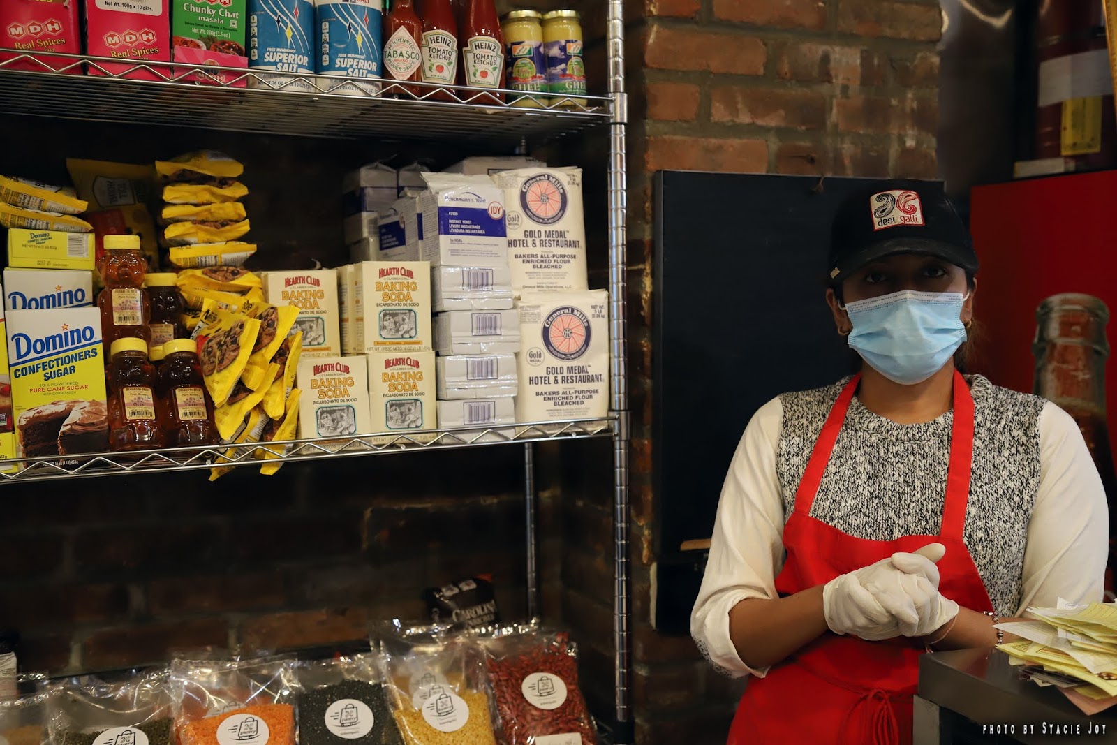 EV Grieve Desi Galli opens a pantry section, with meal kits, supplies