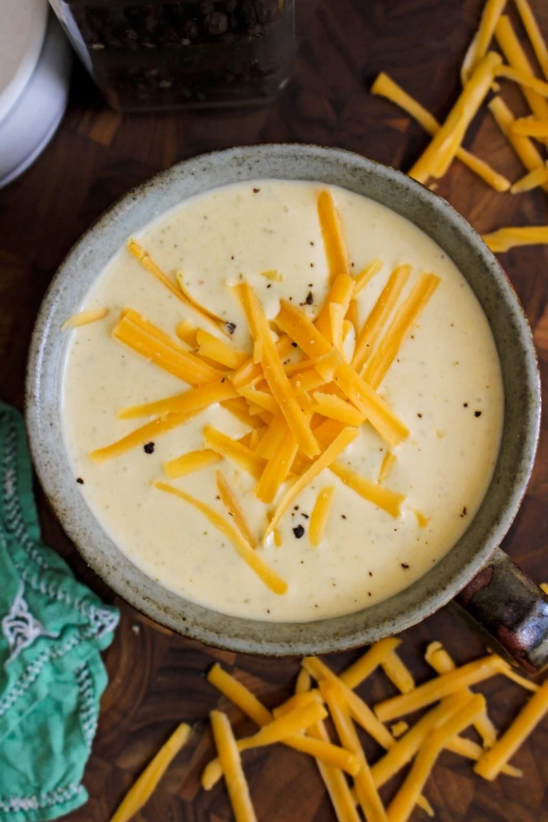 With just a few simple ingredients and the help of your pressure cooker, you can make a creamy, cheesy, restaurant-worthy Broccoli Cheese Soup at home in less than 30 minutes! #instantpot #broccolicheesesoup #souprecipe
