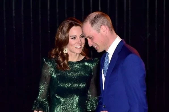 Kate Middleton wore The Vampire's Wife Falconetti emerald midi dress, Brora gold charm earrings. Meghan Markle