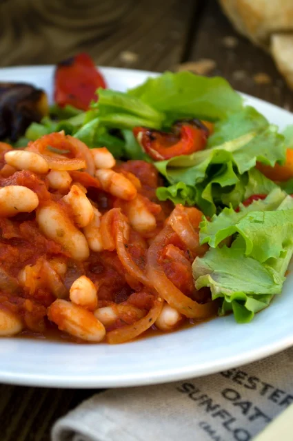 Rustic Greek Beans (Fasolia Gigantes).A rich bean stew high in protein, fibre and iron. Easy to make and very tasty. Serve with crusty bread and salad or steamed vegetables, Suitable for vegetarians and vegans.