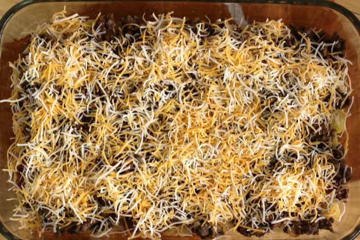 Cheeseburger Casserole Recipe cheese over seasoned ground beef in pan