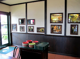 View of the one-twelfth-scale miniature scenes set into the wall of Mr Badger's cafe at Tawhiti Museum..