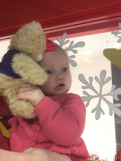 Baby Girl cuddling teddy bear