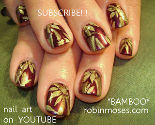 bamboo nails, bamboo nail art, maroon and gold nail, simple blue flower nail, blue flower nail, french nail with blue, marigold nail,