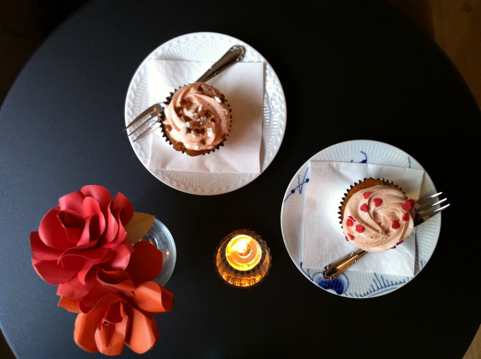 two cupcakes on a black table at Serenity Cupcakes in Copenhagen
