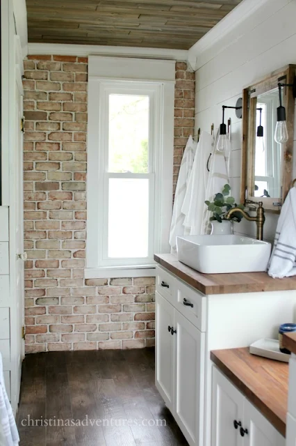 white shiplap and brick wall bathroom