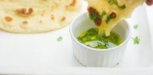 garnish-the-naan-with-butter-and-coriander-leaves
