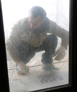 A workmen outside the window of Room 13 A workmen outside the window of Room 13