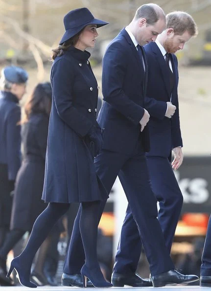 Duchess Catherine -Kate Middleton wore a double wool coat by Carolina Herrera. Jimmy Choo Georgia shoes.