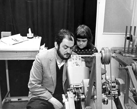 Stanleyb Kubrick and his daughter looking at footage