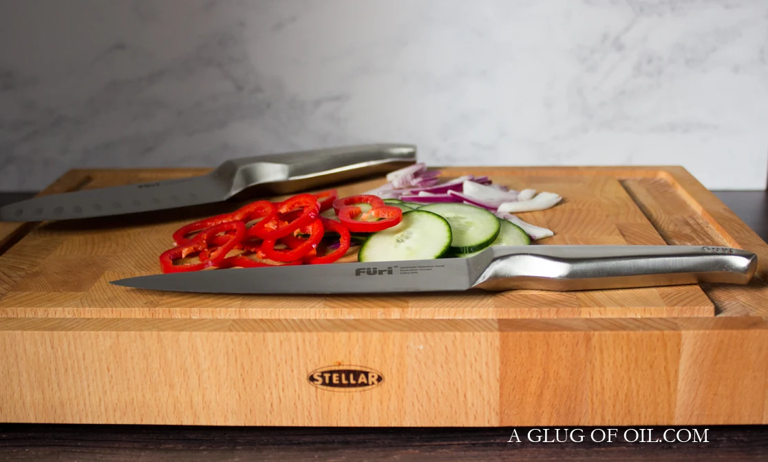 Furi knives on wooden chopping board