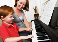 picture of piano teacher $ student