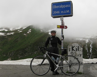 pep with bicycle at the summit of the Oberalppass, altitude 2046 meters, Switzerland