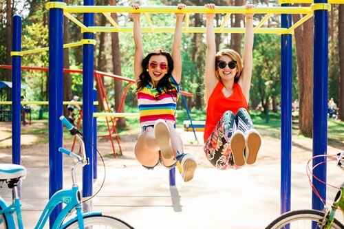 Happy with friends while enjoying the slide Happy with friends while enjoying the slide