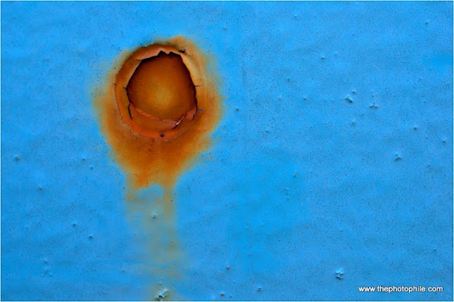 The Photophile: A Rust Coloured Sun Rises in a Blue Sky!