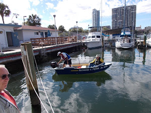 Fred and Hugh testing Hugh's new  9.9 hp motor with Chucky, while Joe looks on.